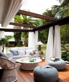 make an intimate outdoor living room with some curtains
