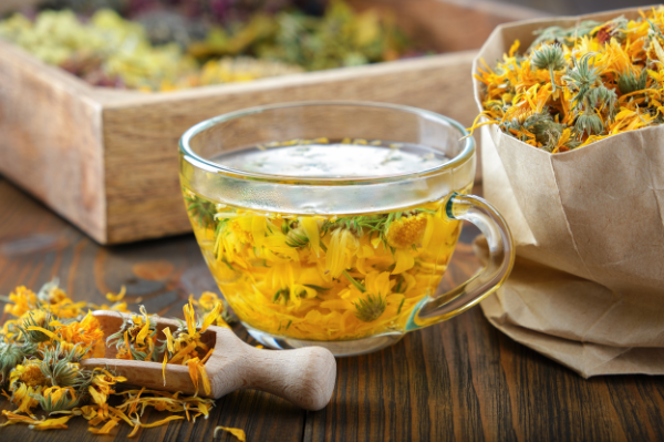 Marigold flowers in a cup of water